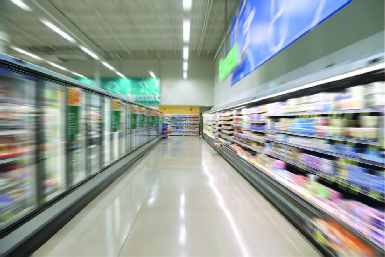 blurry refrigerator aisle in a grocery store for label applications